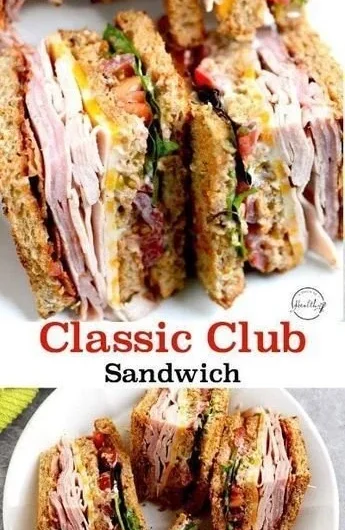Delicious club sandwich with turkey, ham, and bacon stacked high on a plate.