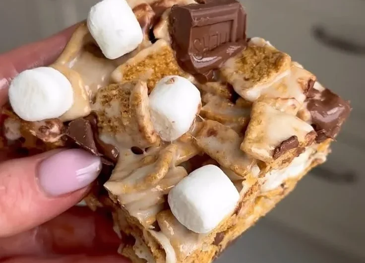 Delicious Golden Grahams S'mores Bars stacked on a plate