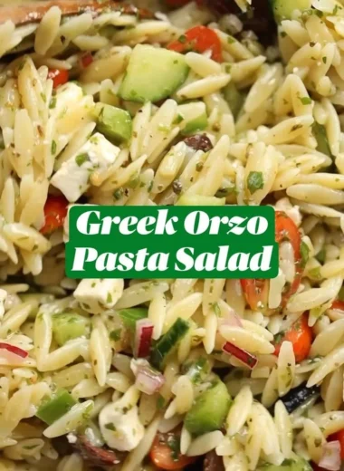 Bowl of Greek Orzo Pasta Salad with fresh vegetables and feta cheese