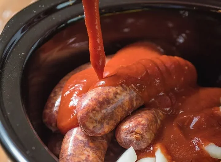 Slow Cooker Sausage with Peppers and Onions served in a bowl