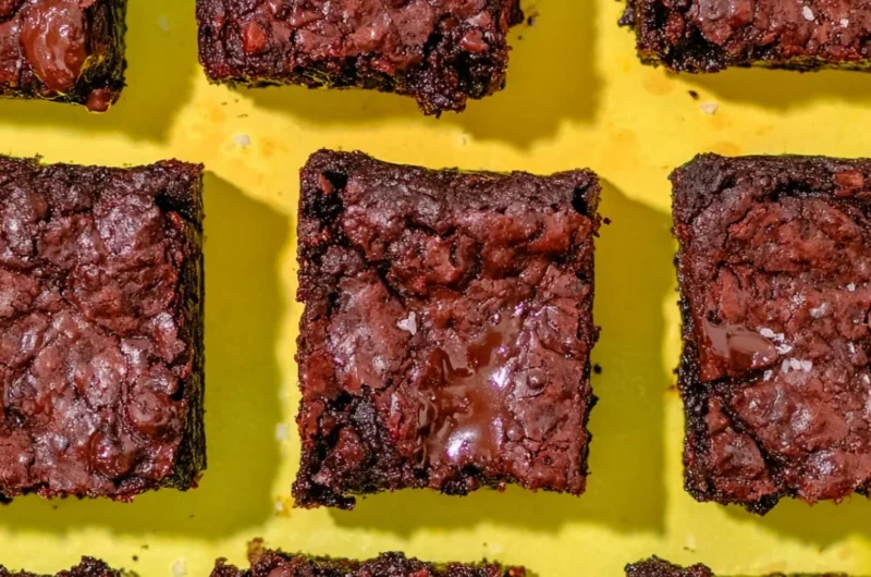 Delicious 90-calorie protein brownies with crackly tops on a plate