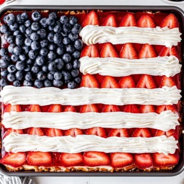 Delicious Strawberry Pretzel Jello Salad served in a clear dish.