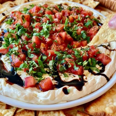 A vibrant Bruschetta Dip served with crunchy bread for dipping.