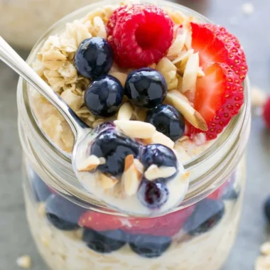 Bowl of easy overnight oats topped with fresh fruits and nuts.