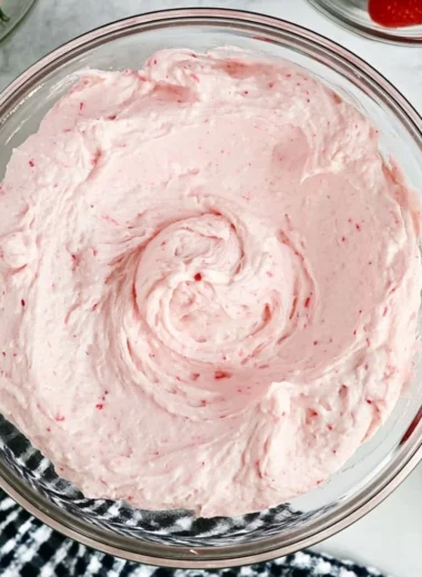 Delicious fresh strawberry buttercream frosting in a bowl