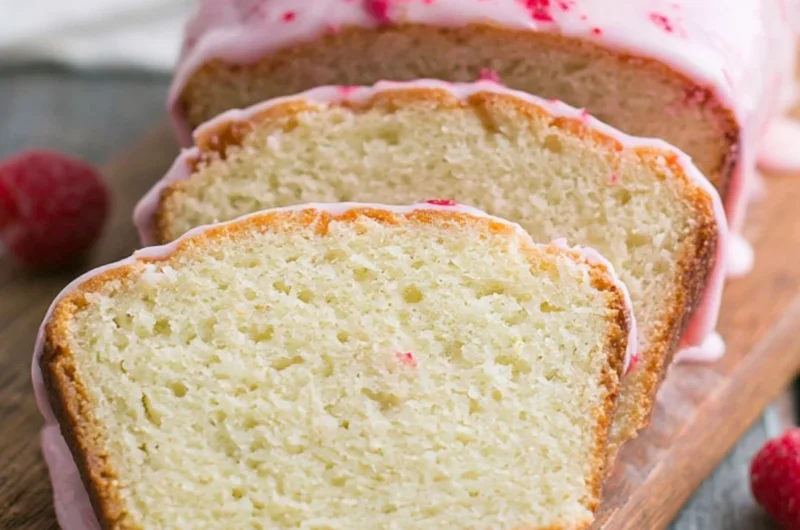 Delicious Key Lime Cake topped with vibrant raspberry glaze