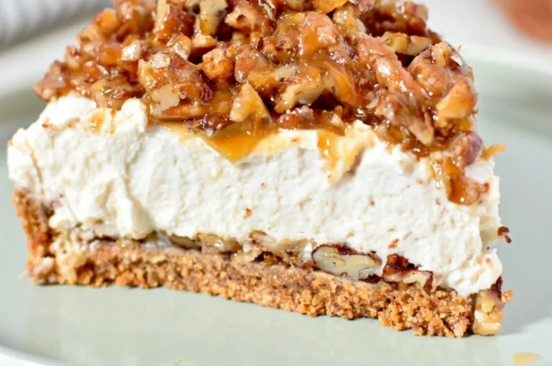 No-Bake Keto Pecan Pie Cheesecake topped with pecans and caramel sauce