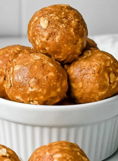 Healthy no bake pumpkin protein balls with nuts and seeds on a plate