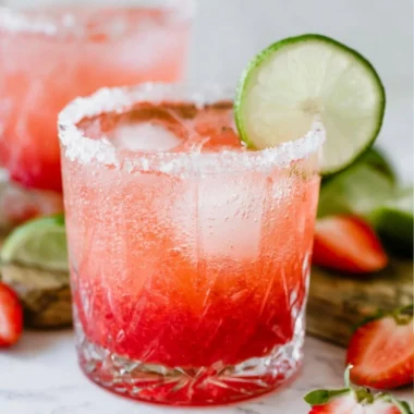 Refreshing Strawberry Lime Non-Alcoholic Margarita in a glass with mint leaves