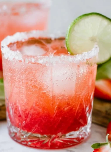 Refreshing Strawberry Lime Non-Alcoholic Margarita in a glass with mint leaves