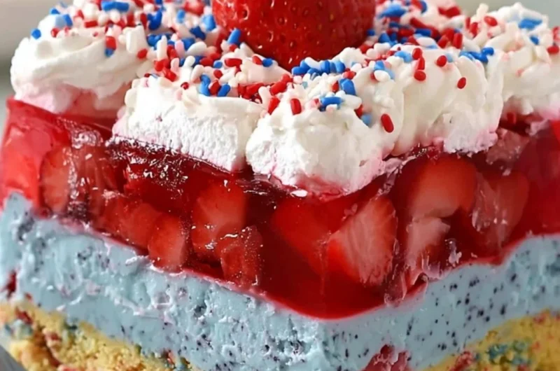 A slice of summer berry dessert lasagna with colorful fruit layers