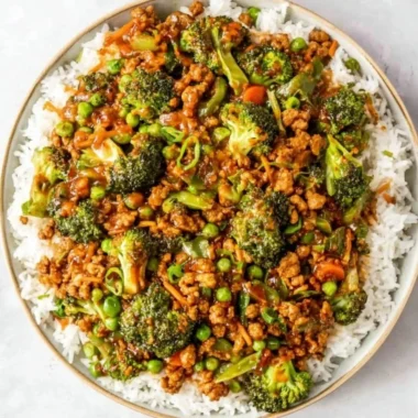 Delicious Teriyaki Ground Turkey served with broccoli and peas