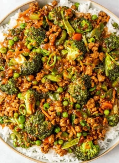 Delicious Teriyaki Ground Turkey served with broccoli and peas