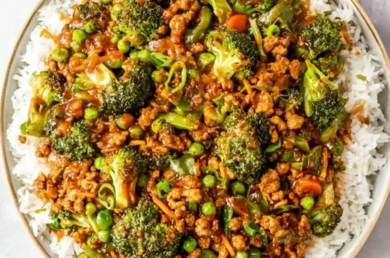 Delicious Teriyaki Ground Turkey served with broccoli and peas