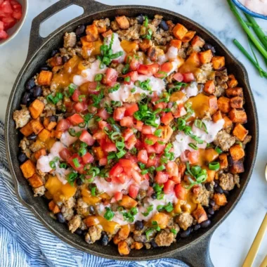 Turkey Sweet Potato Skillet with colorful vegetables in a frying pan