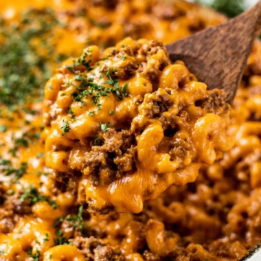 Delicious cheeseburger casserole topped with cheese and herbs
