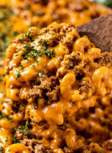 Delicious cheeseburger casserole topped with cheese and herbs