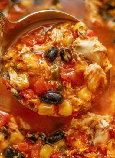 Bowl of Chicken Tortilla Soup topped with tortilla strips and fresh cilantro