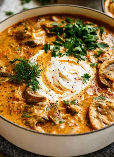 Creamy Hungarian Mushroom Soup garnished with fresh herbs and spices