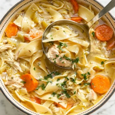 Bowl of easy chicken noodle soup with vegetables and noodles.