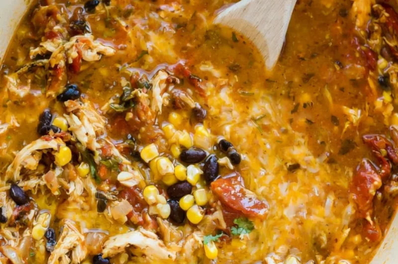 Bowl of easy chicken tortilla soup topped with crispy tortilla strips and cilantro.