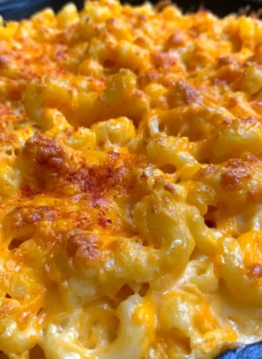 Serving of homemade Traeger smoked mac and cheese topped with breadcrumbs.