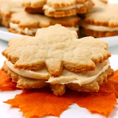 Delicious homemade Maple Cream Cookies stacked on a plate