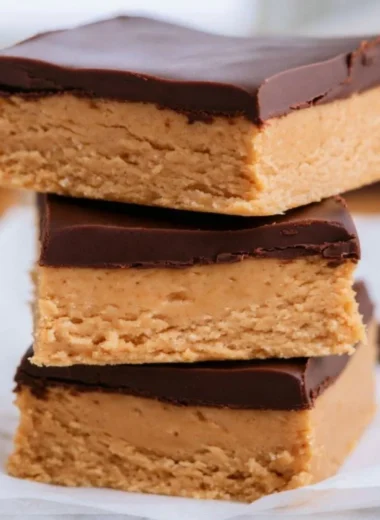 Delicious no-bake peanut butter buckeye bars stacked on a plate