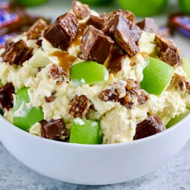 Delicious Snickers Apple Salad with chunks of Snickers and fresh apples