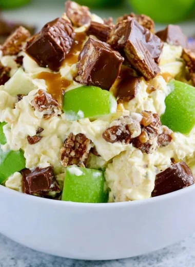 Delicious Snickers Apple Salad with chunks of Snickers and fresh apples