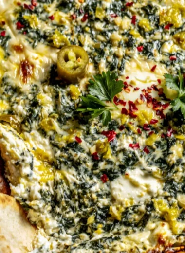 Creamy spinach and pepperoncini baked feta dip served in a bowl