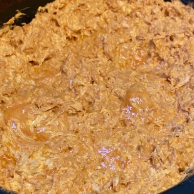 Bowl of warm and creamy buffalo chicken dip with tortilla chips