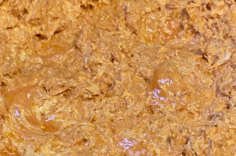 Bowl of warm and creamy buffalo chicken dip with tortilla chips